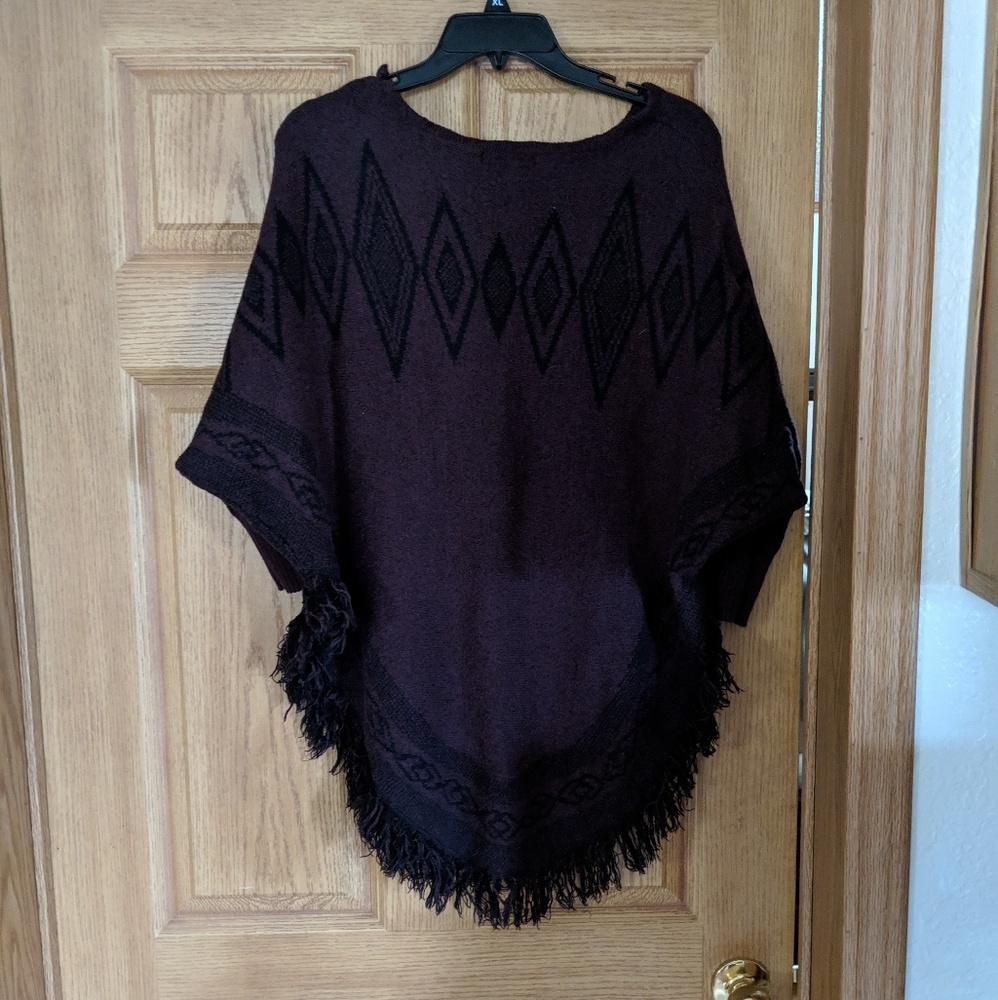 Purple and black frilled poncho sweater